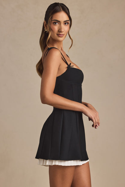 Anouska Black Mini Dress with Bow Straps and Pleated Skirt