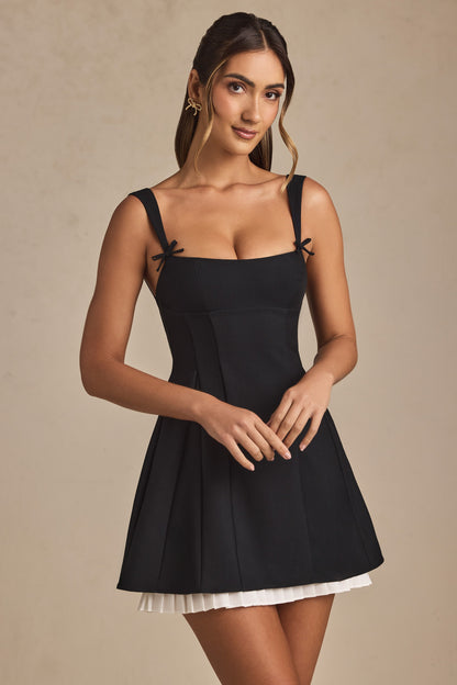 Anouska Black Mini Dress with Bow Straps and Pleated Skirt